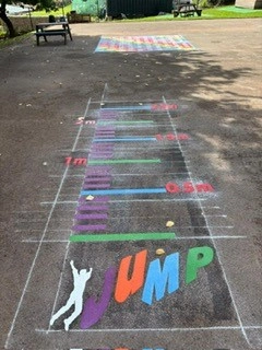 Jumping pad painted in multiple colours on a playgrund