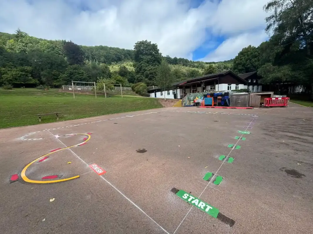 Playground at a primary school wiht multiple different playground markings designs on