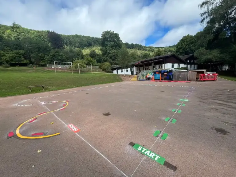 Playground at a primary school wiht multiple different playground markings designs on