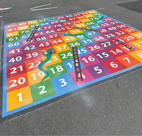 Multi-coloured snakes and ladders on a playground