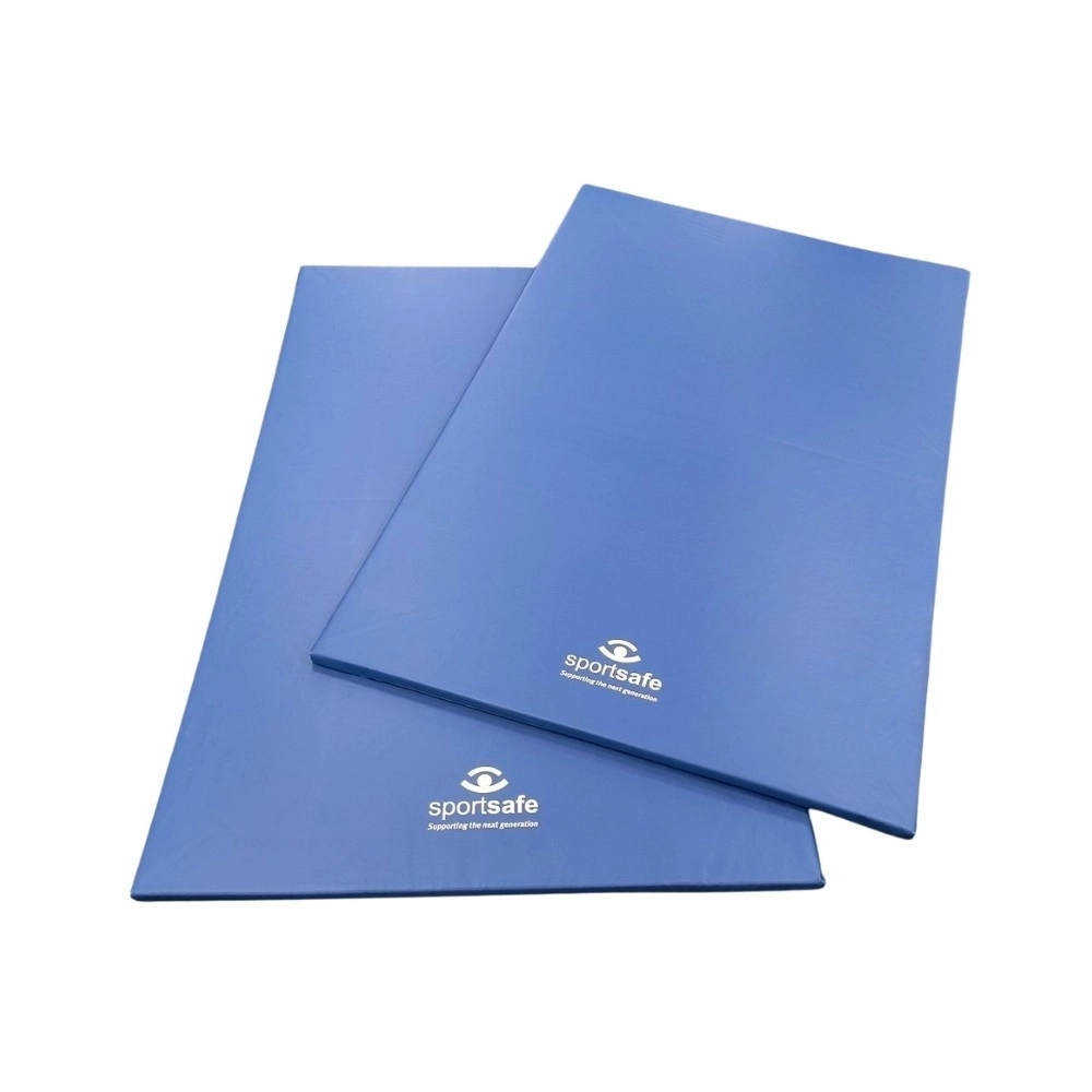 Two sportsafe blue gymnastics mats stacked ontop of one another