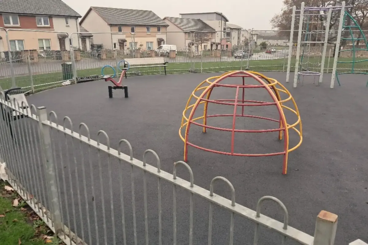 Play park with black wetpour surfacing